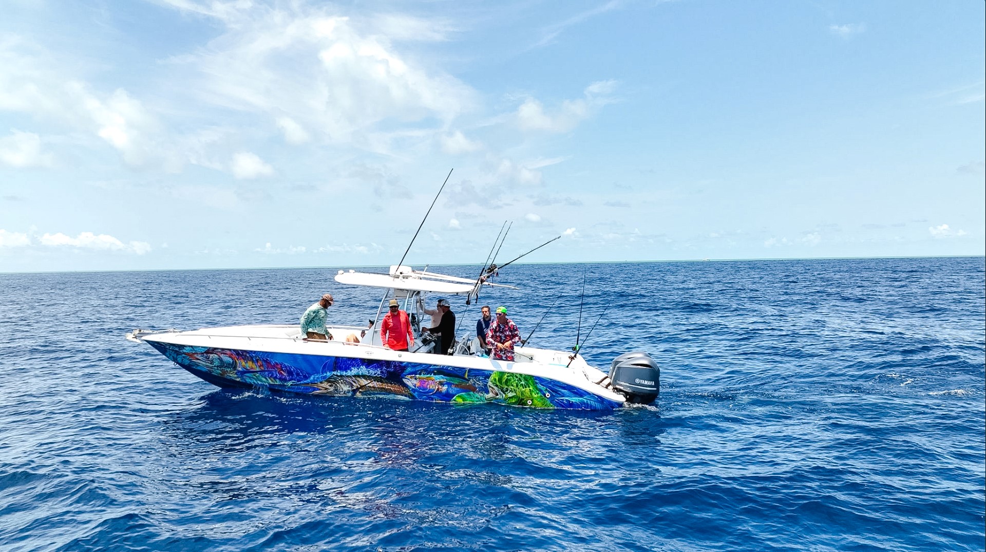 Anglers fishing aboard our Baja boat, captured in a mesmerizing drone shot showcasing the thrilling moments on the water with Belize Reef Charters