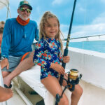 young girl fishing in belize