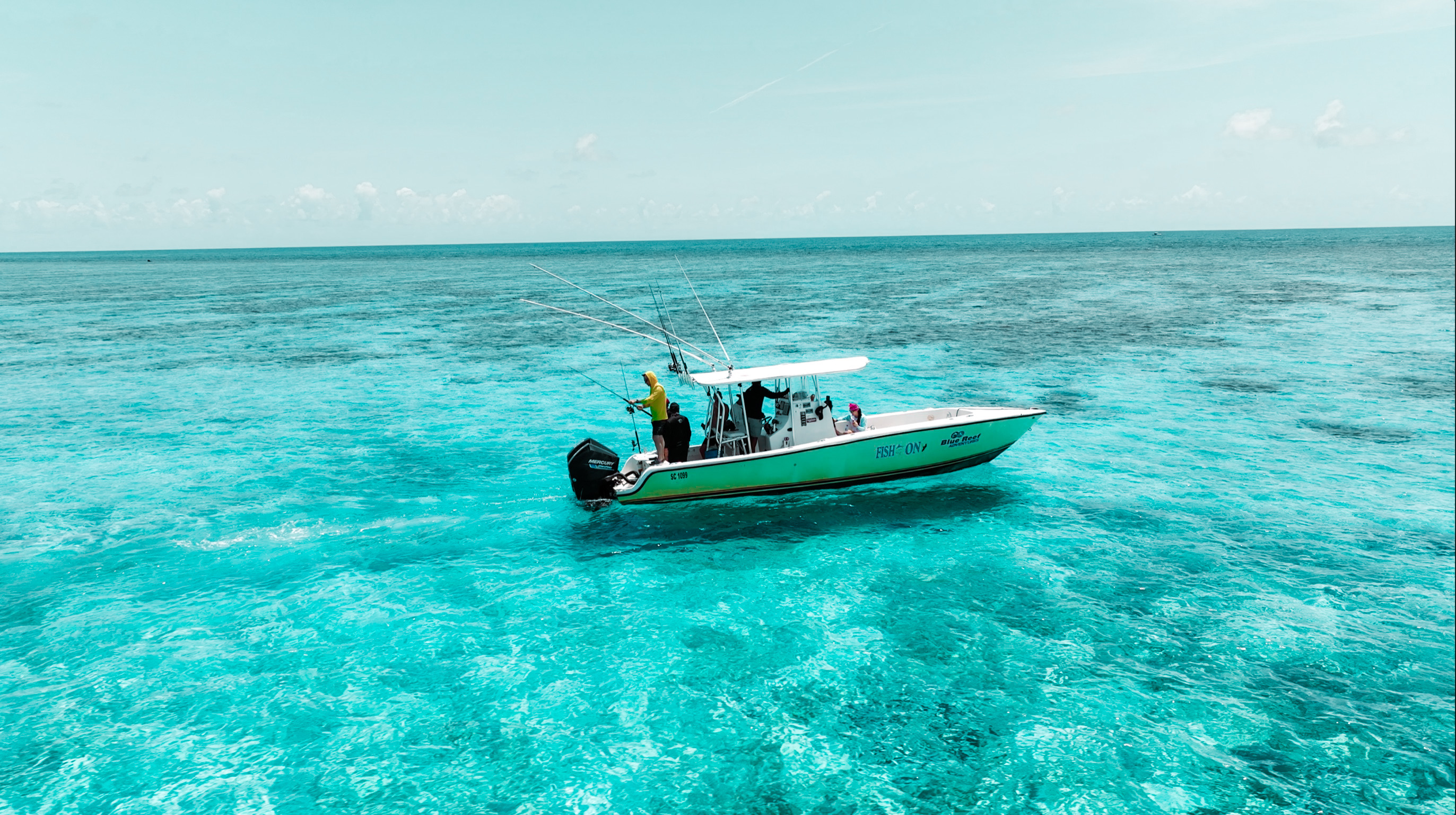 fishing boat on belize coral reef