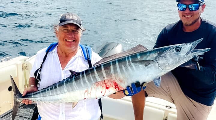 A large mackerel fish caught during a Belize reef fishing trip, showcasing the abundance of marine life in Belize Reef waters.