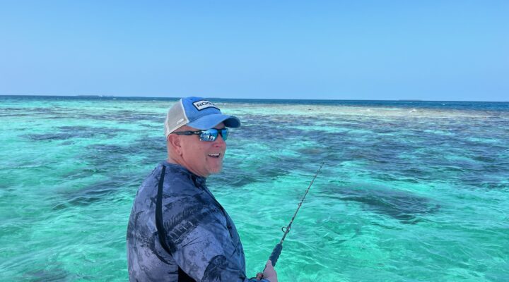 A guest fishing on the beautiful belize barrier reef