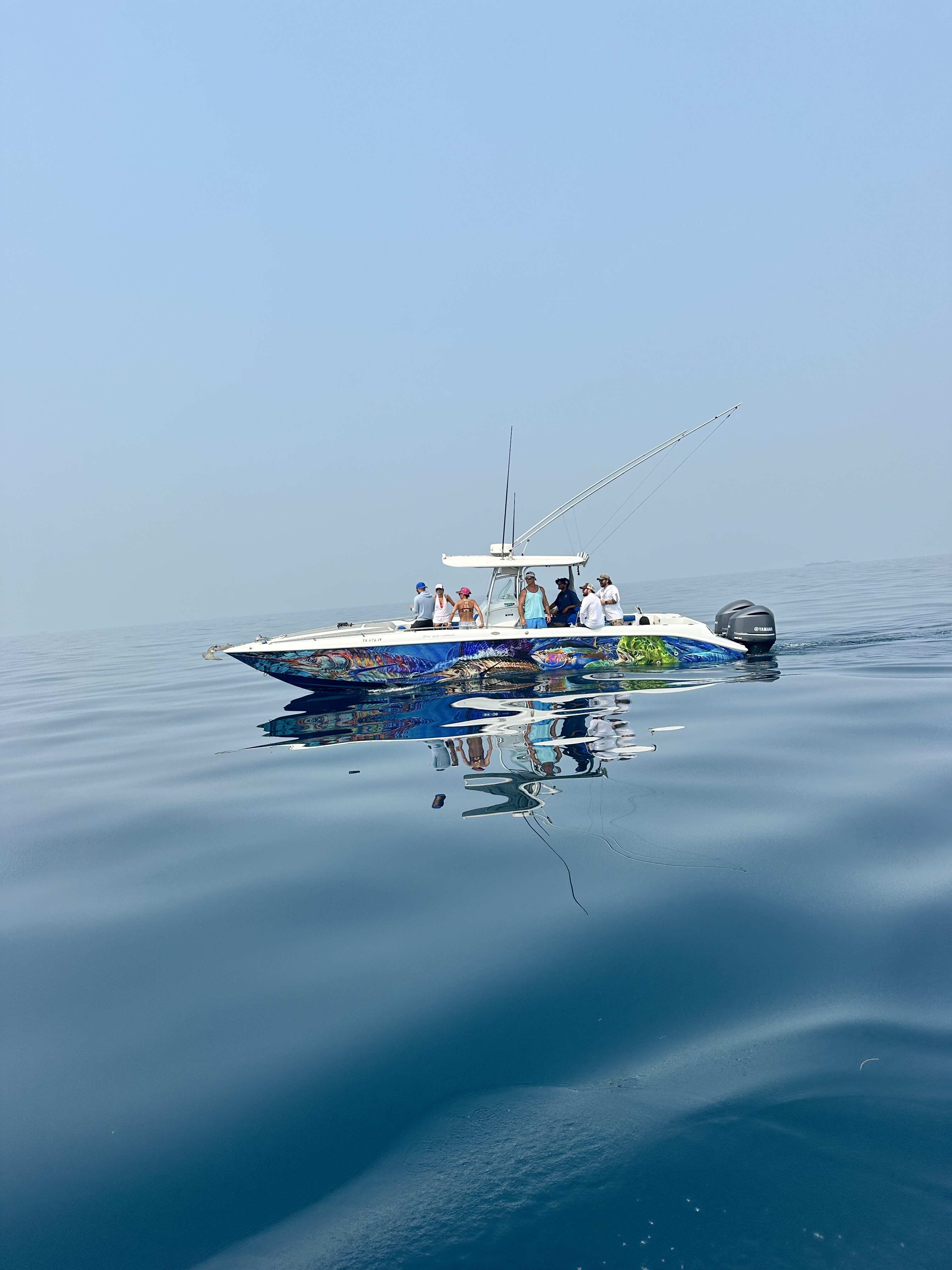 A sport fishing boat for a deep sea fishing charter in belize.